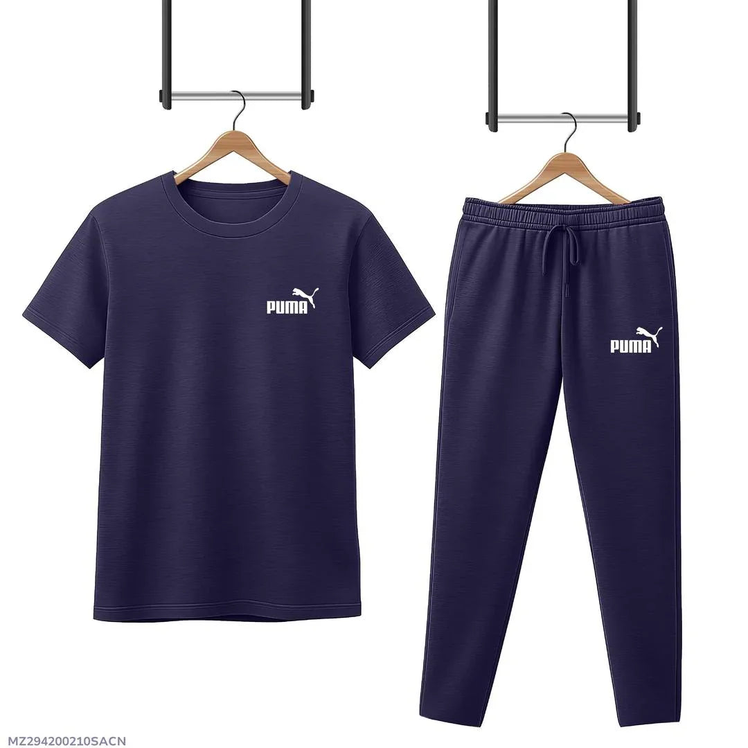 Navy blue Puma tracksuit set with short sleeve t-shirt and joggers on wooden hangers