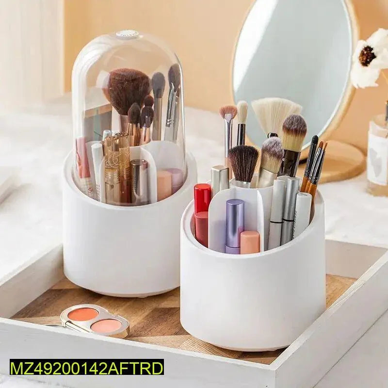 White makeup organizer with brushes, lipsticks, and skincare on vanity tray near mirror