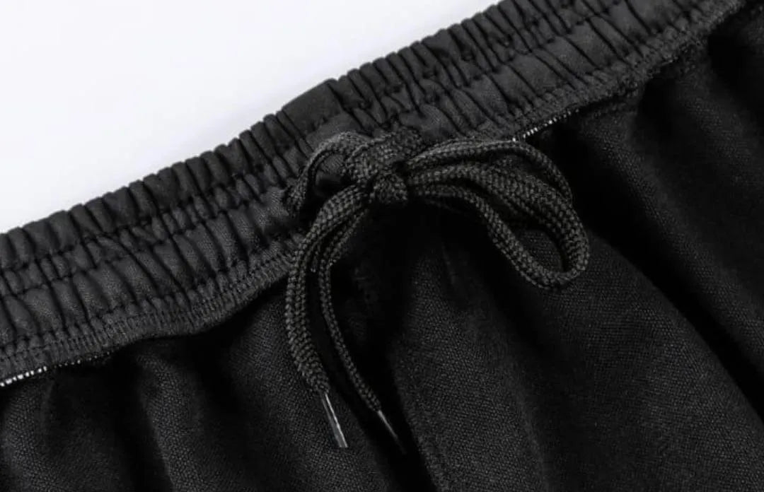 Black elastic waistband shorts with drawstring close-up