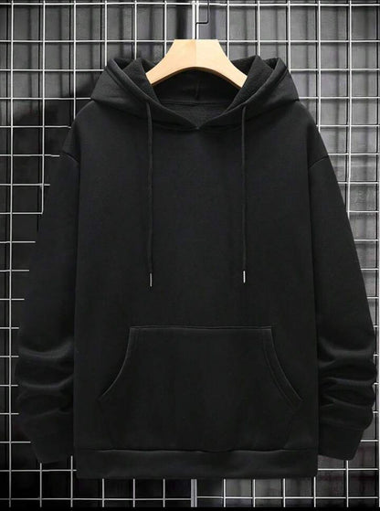 Black hoodie with front pocket and drawstrings displayed on hanger against grid wall