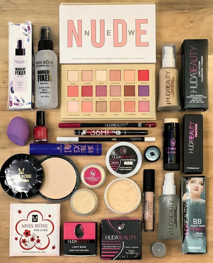 Makeup kit with nude eyeshadow palette, Huda Beauty products, face powders, and fixers on table