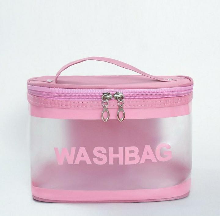 Pink transparent wash bag with zipper and handle on plain white background