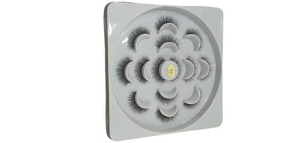 False eyelashes set in circular white tray for makeup and beauty