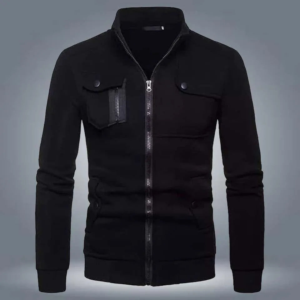 Black zip-up jacket with stand collar and front flap pockets on a grey background