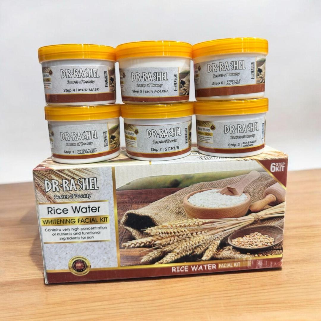 Dr Rashel Rice Water Whitening Facial Kit with six skincare jars and product box on wooden table