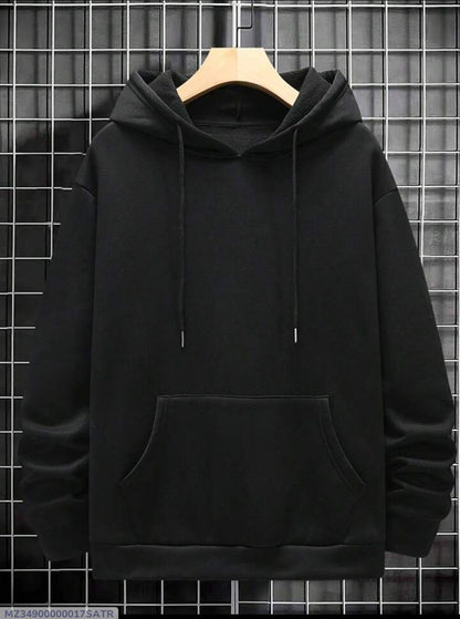 Plain black hoodie with front pocket and drawstrings on hanger against grid wall