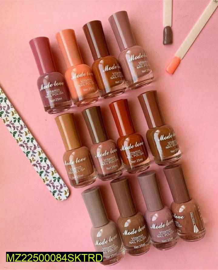 Mode love nail polish bottles in assorted nude and brown shades on pink surface with nail file