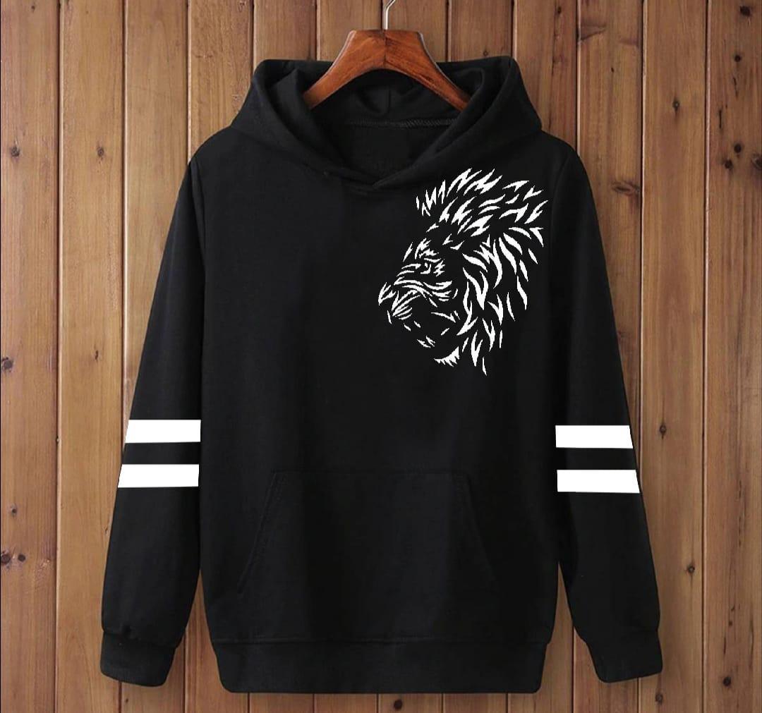 Black hoodie with white lion head graphic and striped sleeves on wooden wall