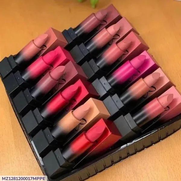 Assorted matte lipsticks in various shades arranged in a black tray on a wooden table.
