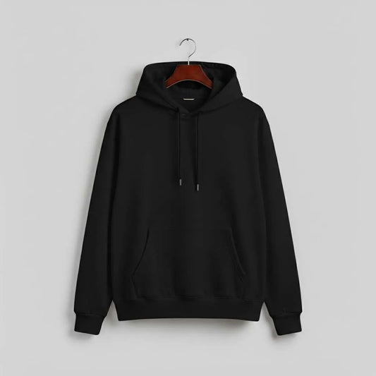 Black hoodie with front pocket and drawstrings on hanger against plain gray background
